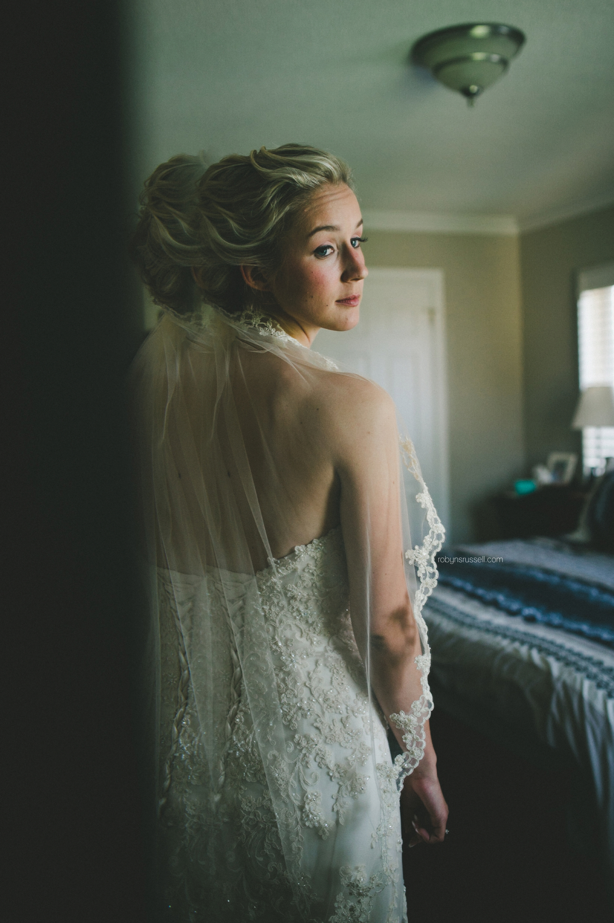 15-bride-looking-in-mirror-on-wedding-day.jpg