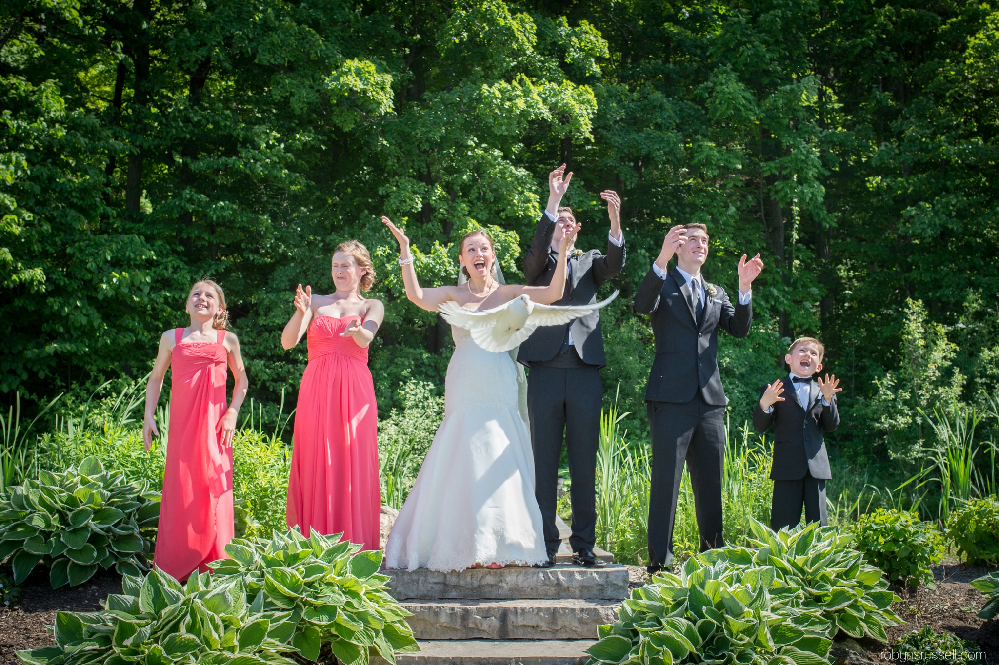 22-doves-flying-during-wedding-ceremony-at-cave-springs.jpg