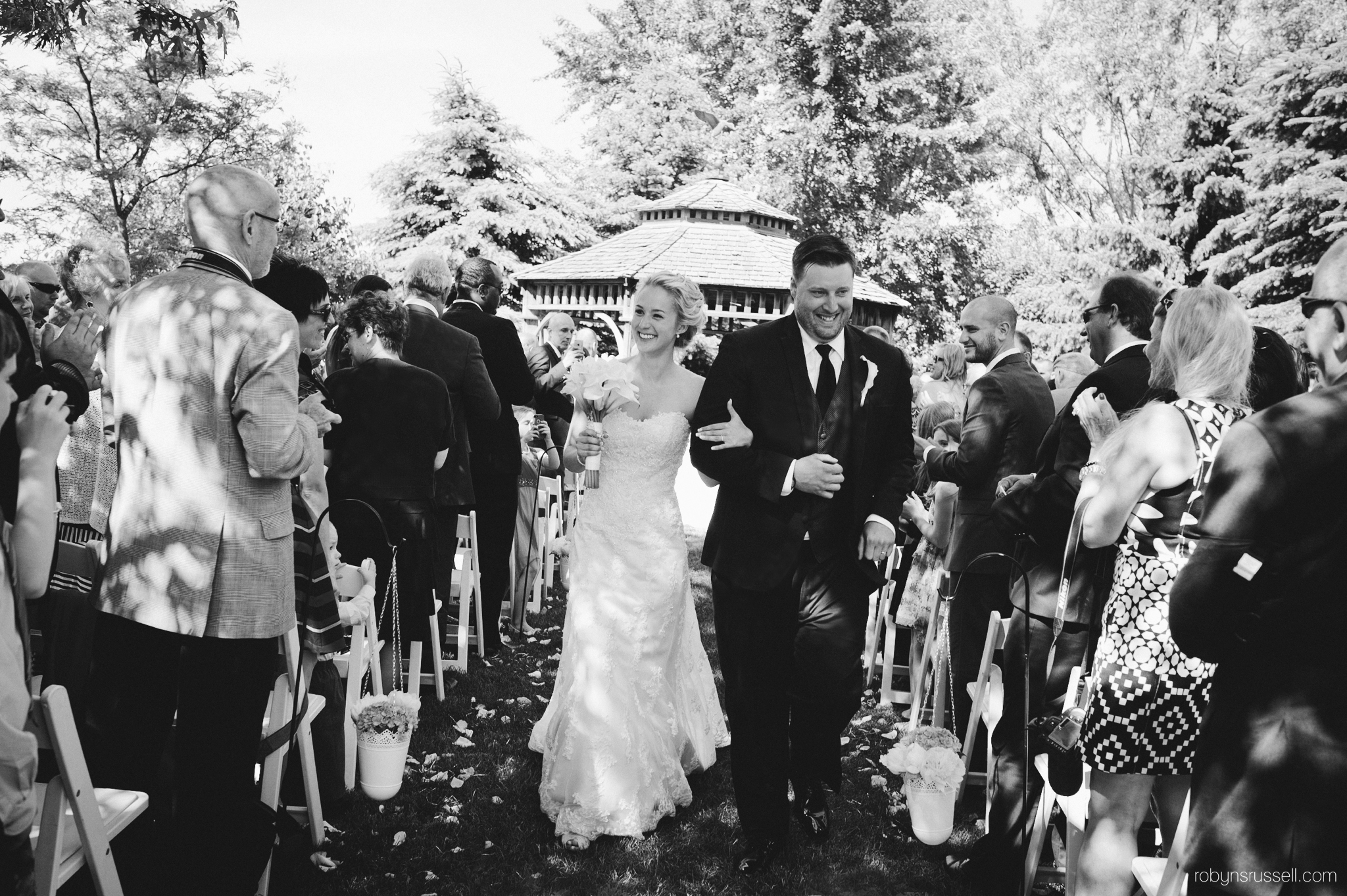 29-bride-and-groom-processional-pipers-heath-bw