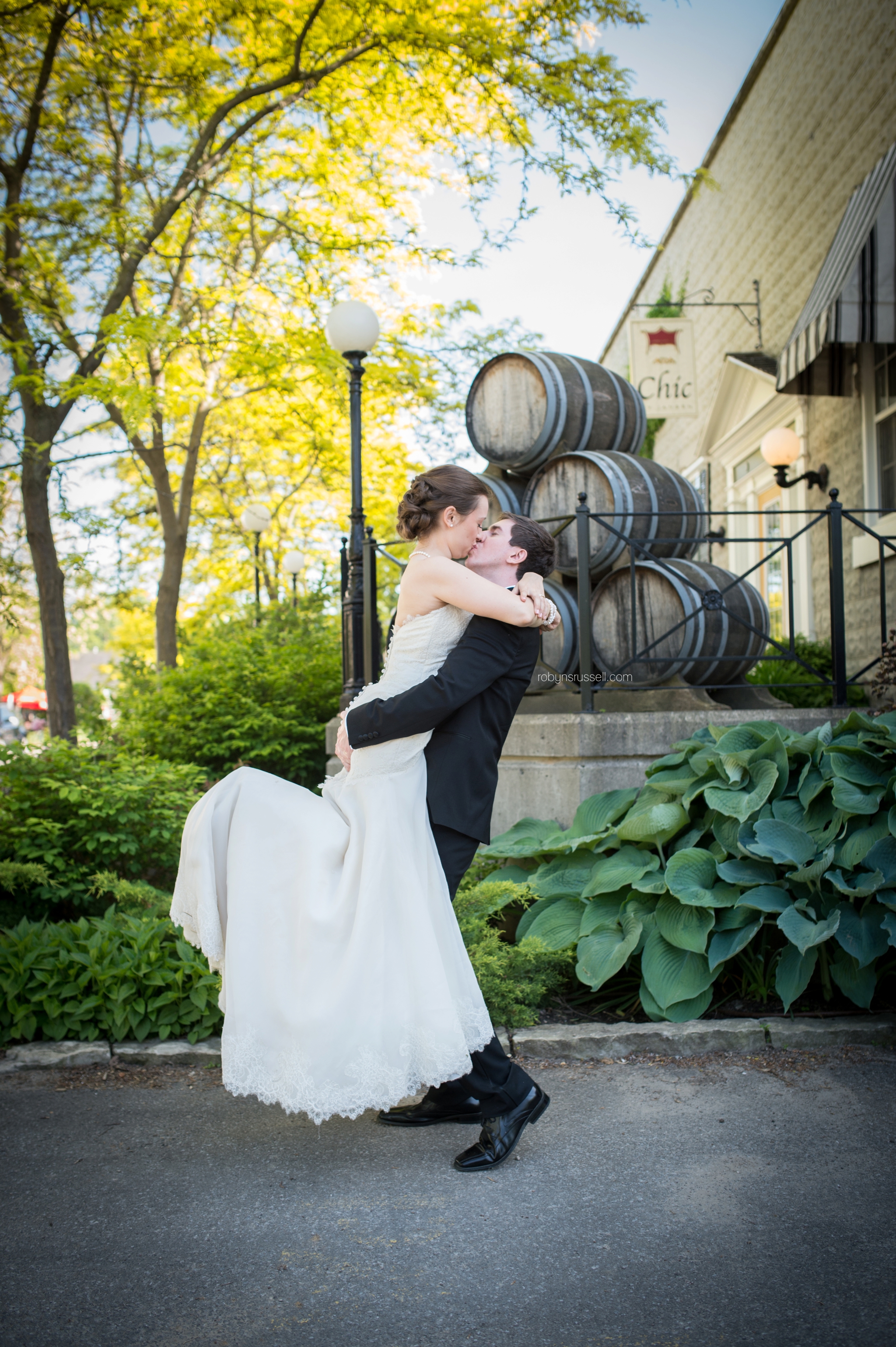 29-groom-lifts-bride-at-inn-on-the-twenty-jordan.jpg