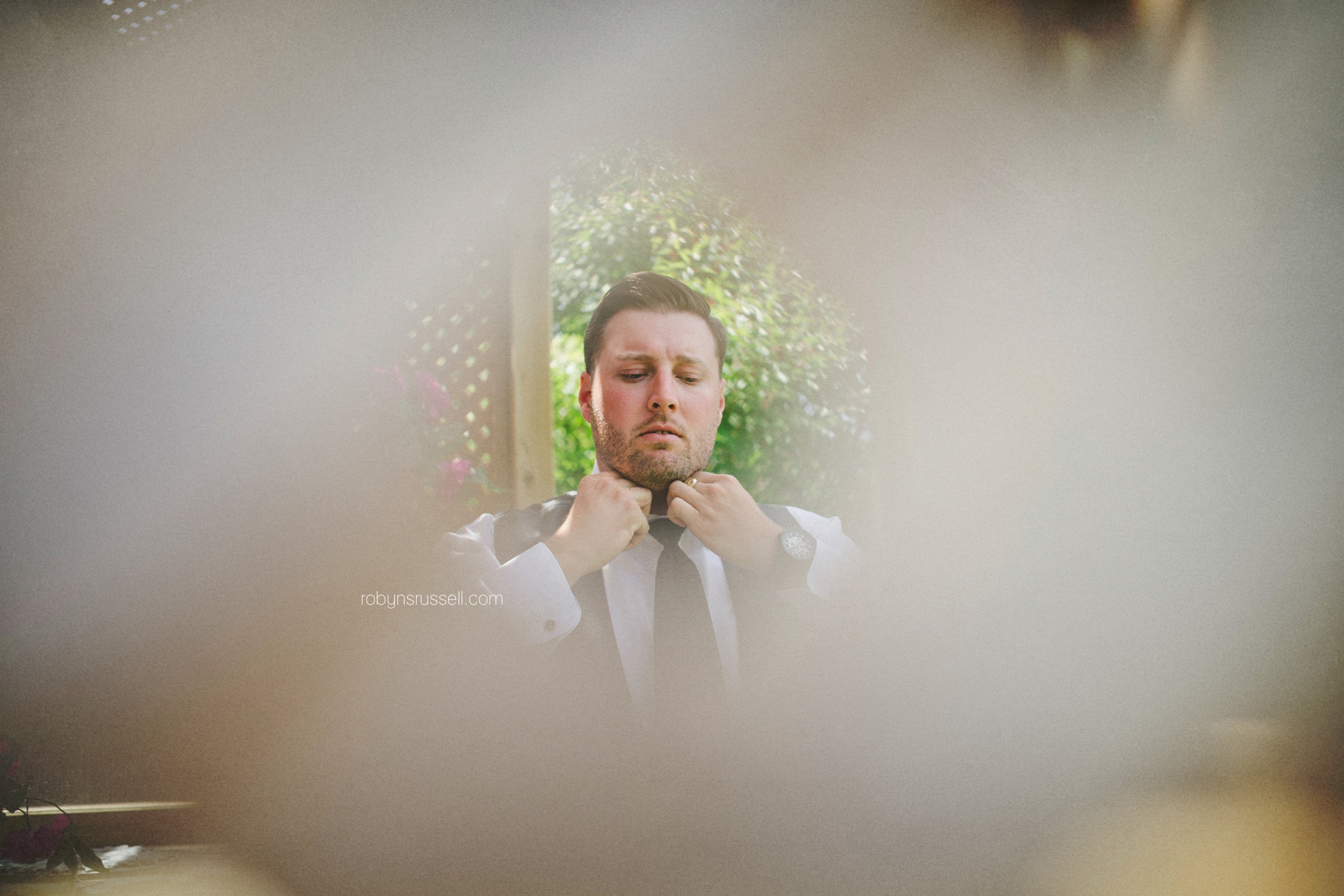 3-groom-putting-on-suit.jpg