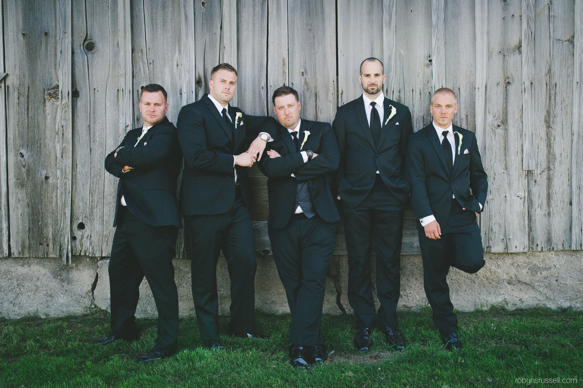 35-grooms-and-groomsmen-serious-pose-pipers-heath.jpg