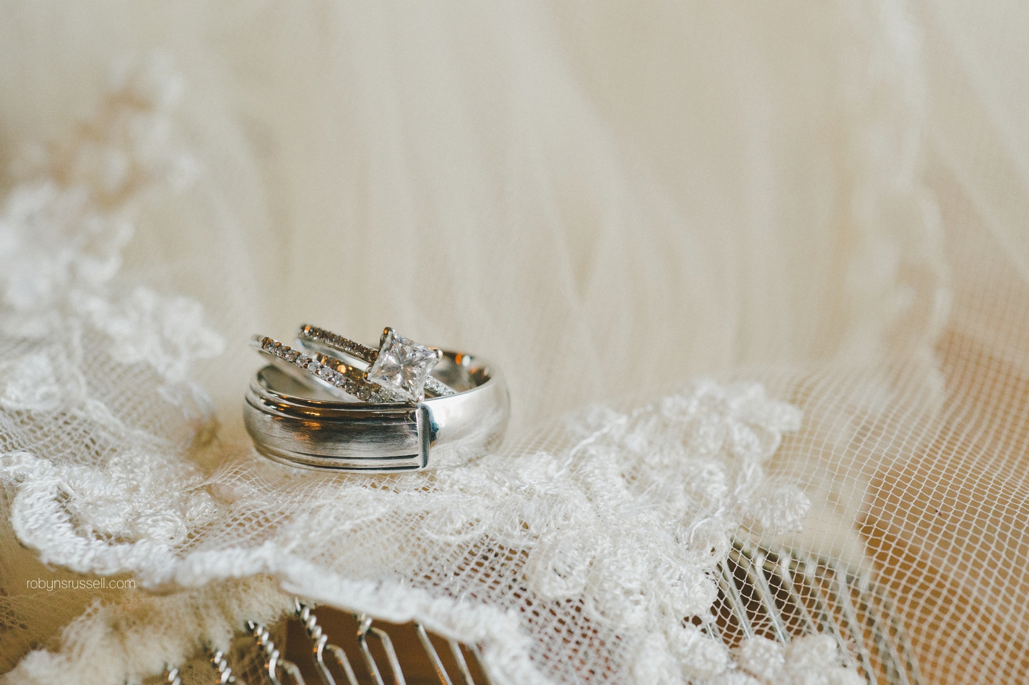 50-bride-and-groom-rings-on-veil.jpg