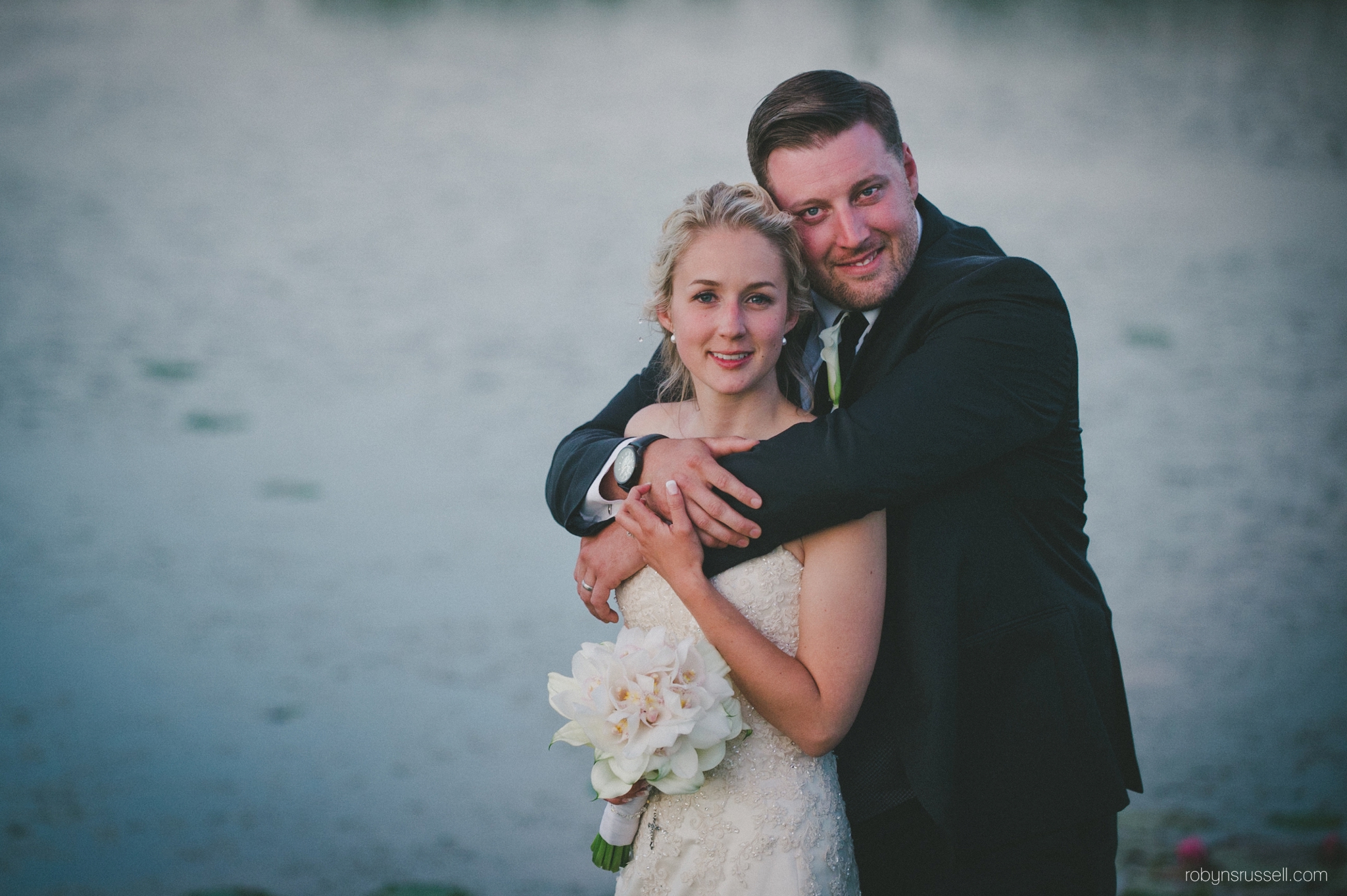 57-bride-and-groom-by-pond-at-dusk.jpg