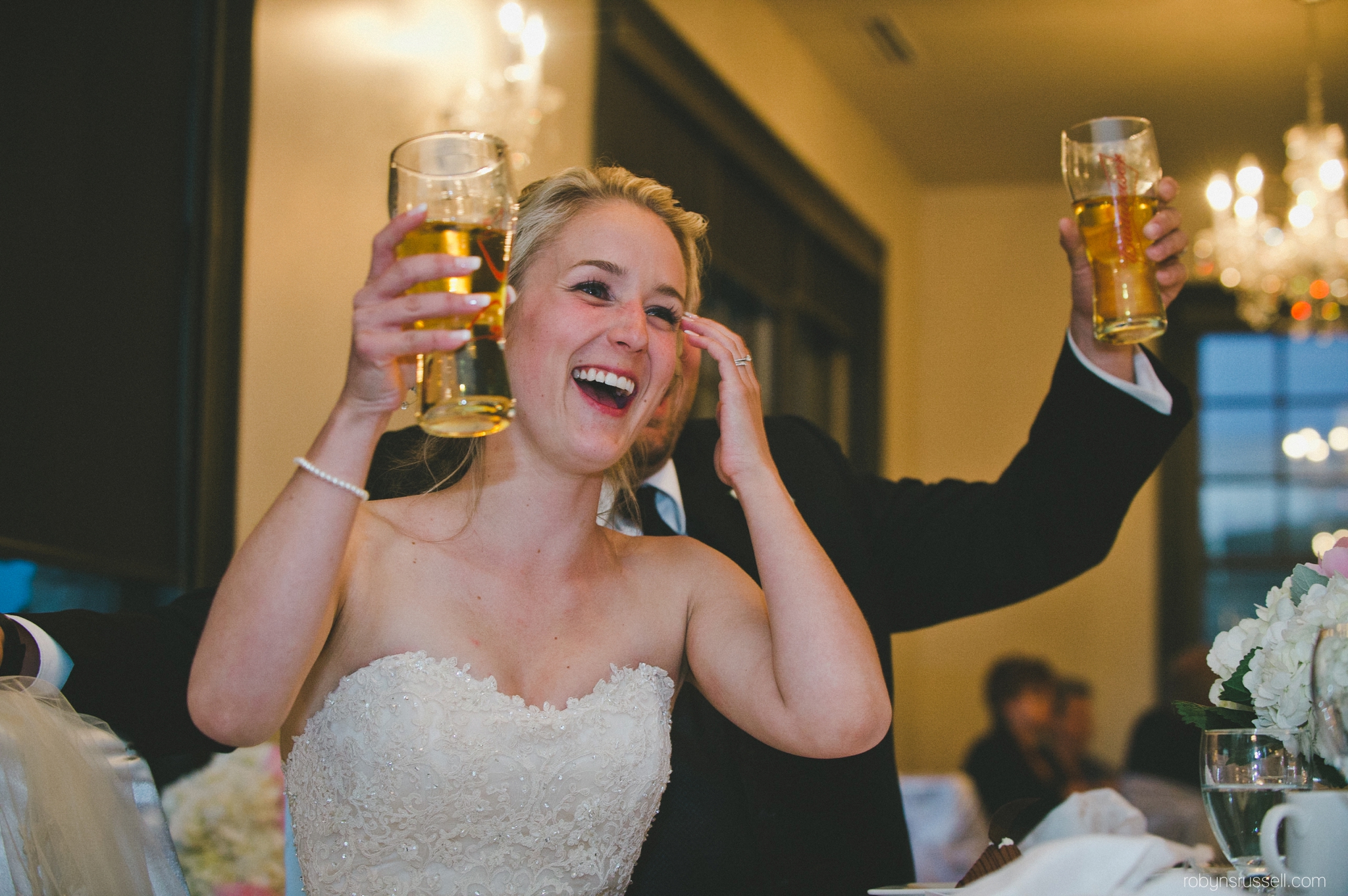 63-bride-having-a-beer-laughing-on-wedding-day.jpg