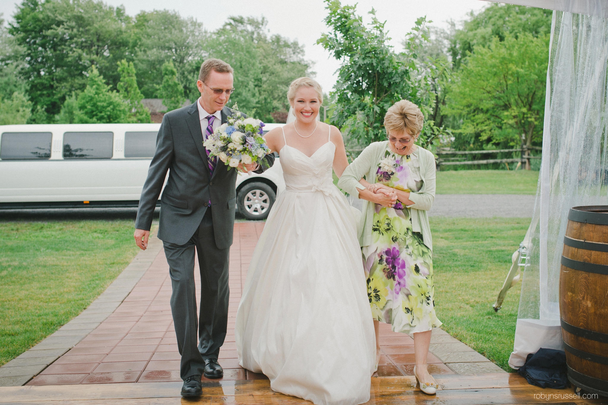 0294-bride-and-parents-walk-aisle.jpg