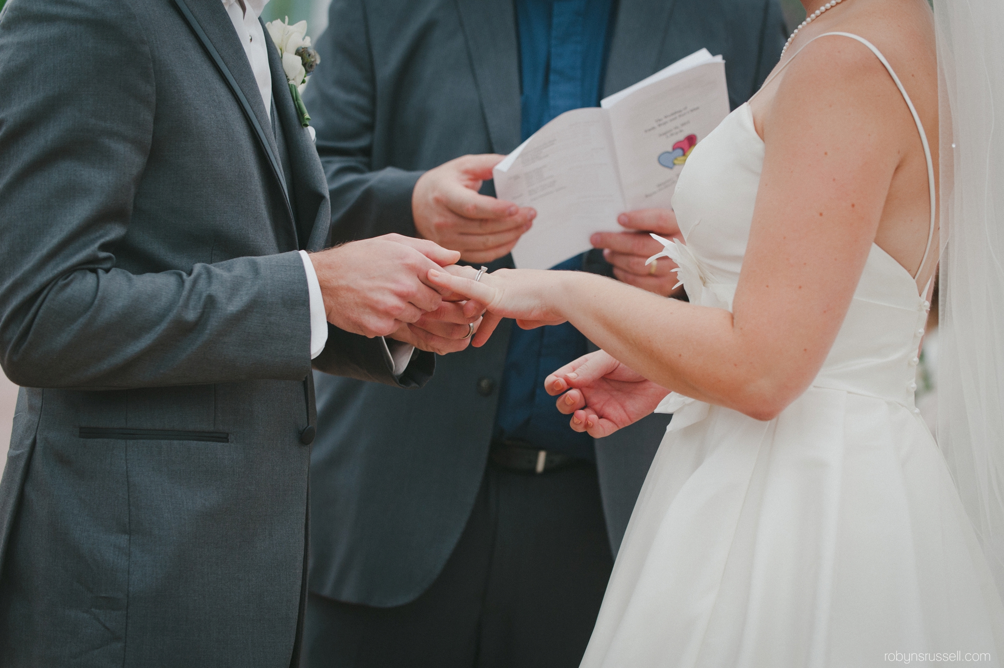 0385-exchanging-rings-bride-and-groom.jpg