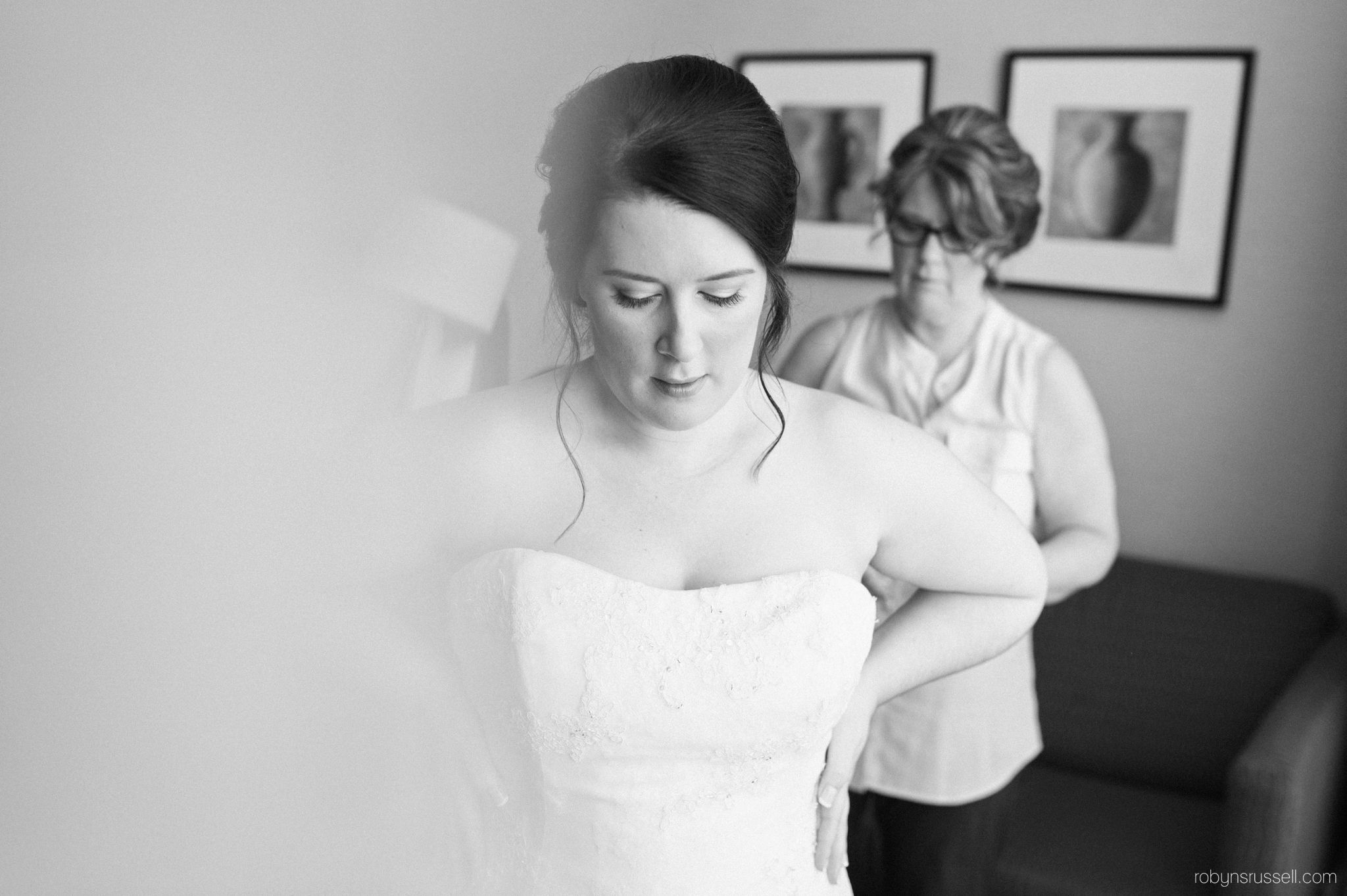 04-bride-getting-dress-on.jpg