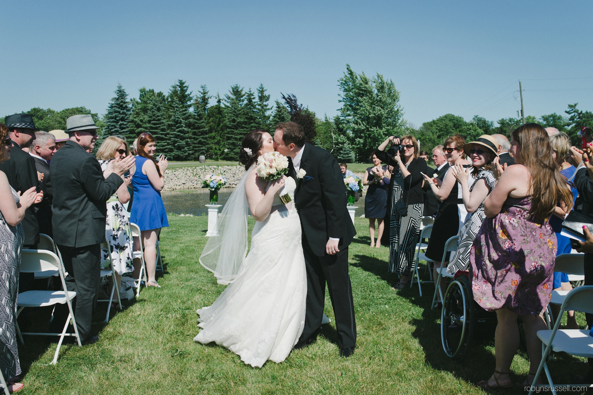 22-bride-and-groom-kiss-recessional.jpg