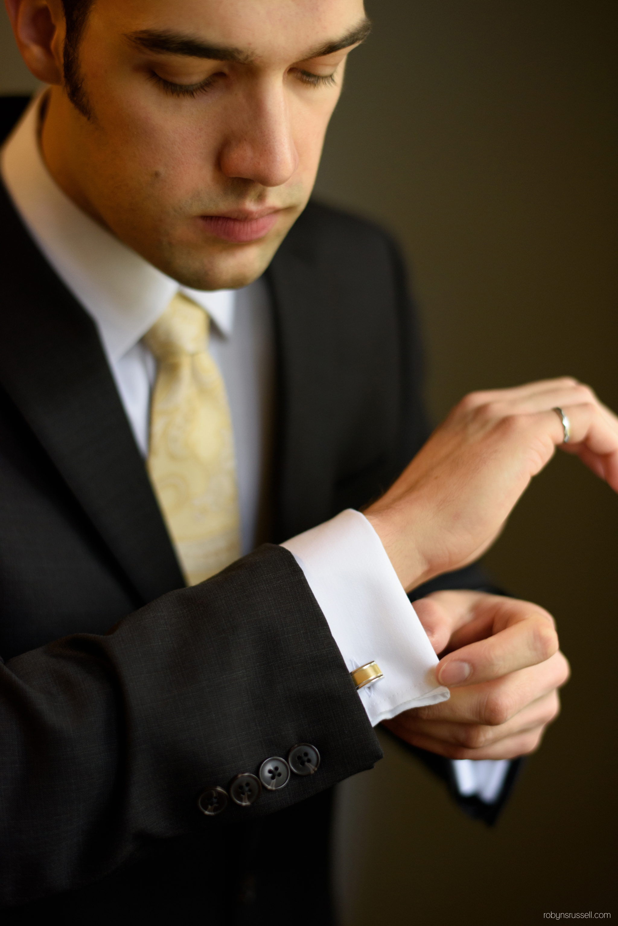 2-groom-wearing-cufflinks-wedding-day.jpg