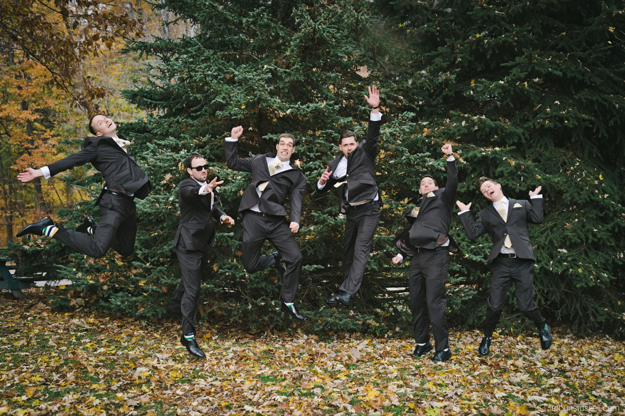 33-groom-and-groomsmen-jumping-bay-socks-canadian-wedding.jpg