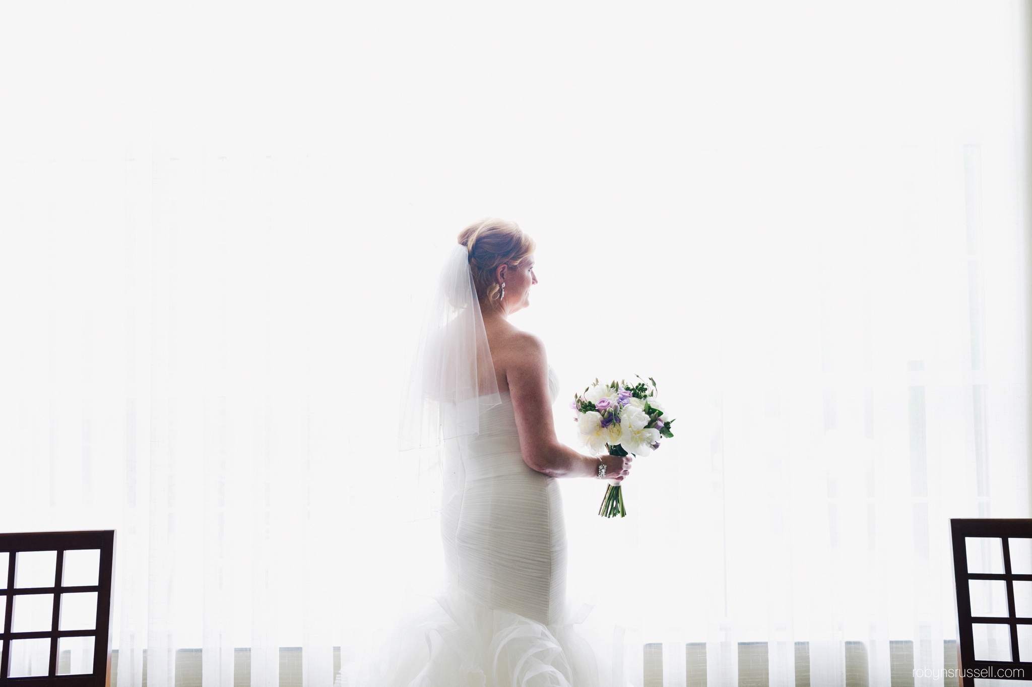 11-bride-by-window-dramatic-portrait-oakville-hotel-staybridge-suites.jpg