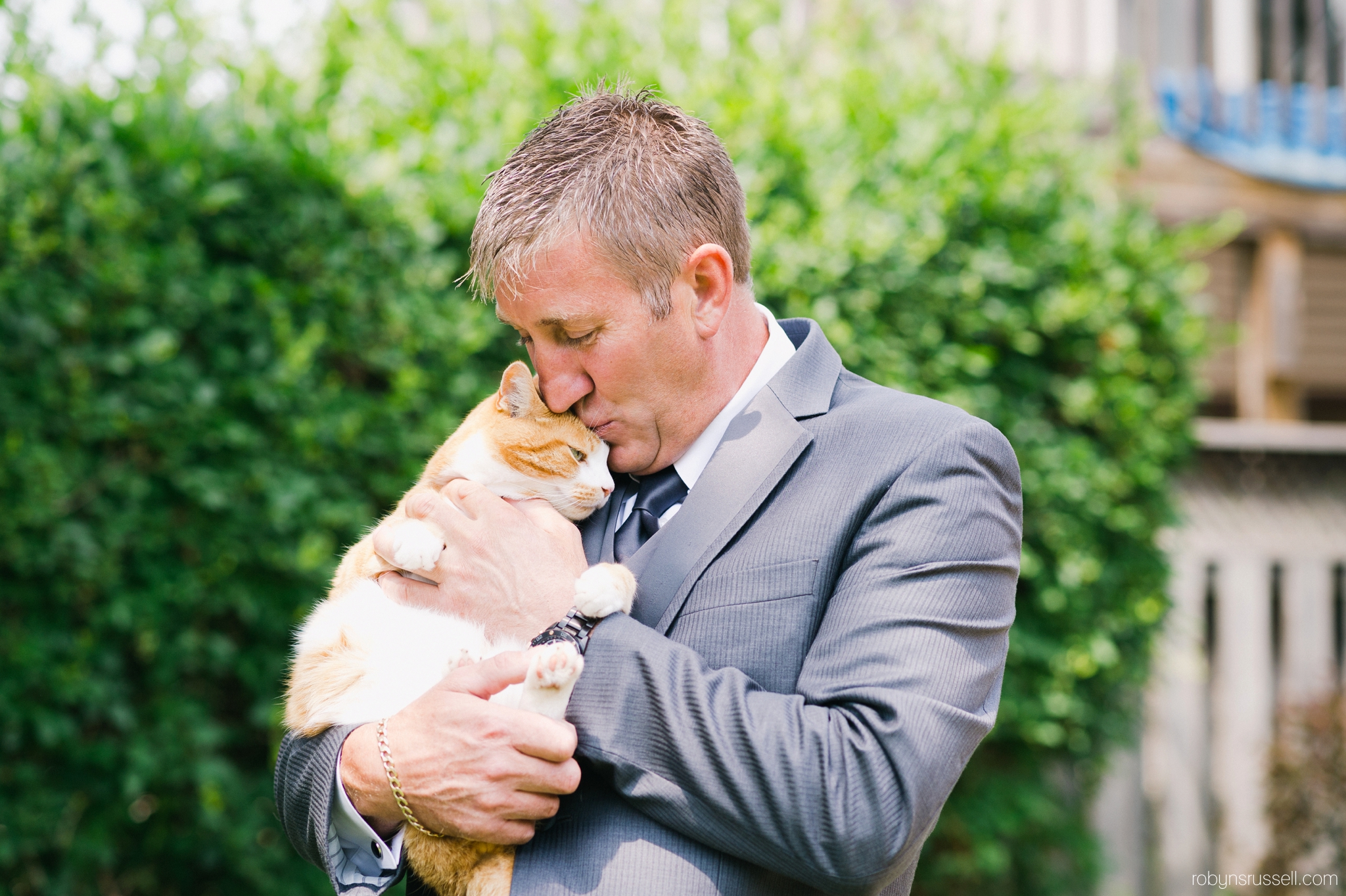 3-groom-with-cat-getting-ready-in-oakville.jpg