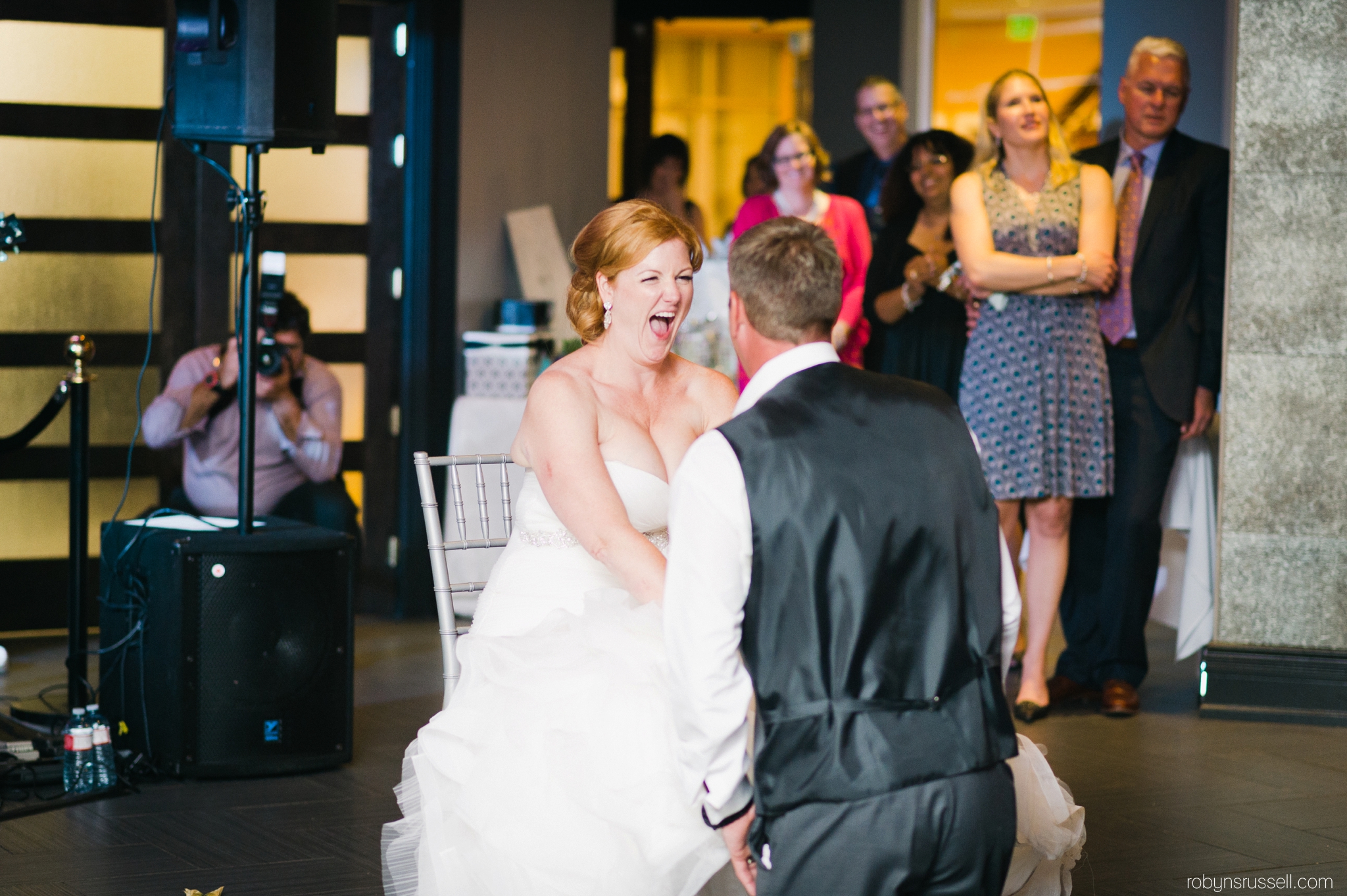 40-bride-and-groom-garter-toss-oakville-wedding-photographer.jpg