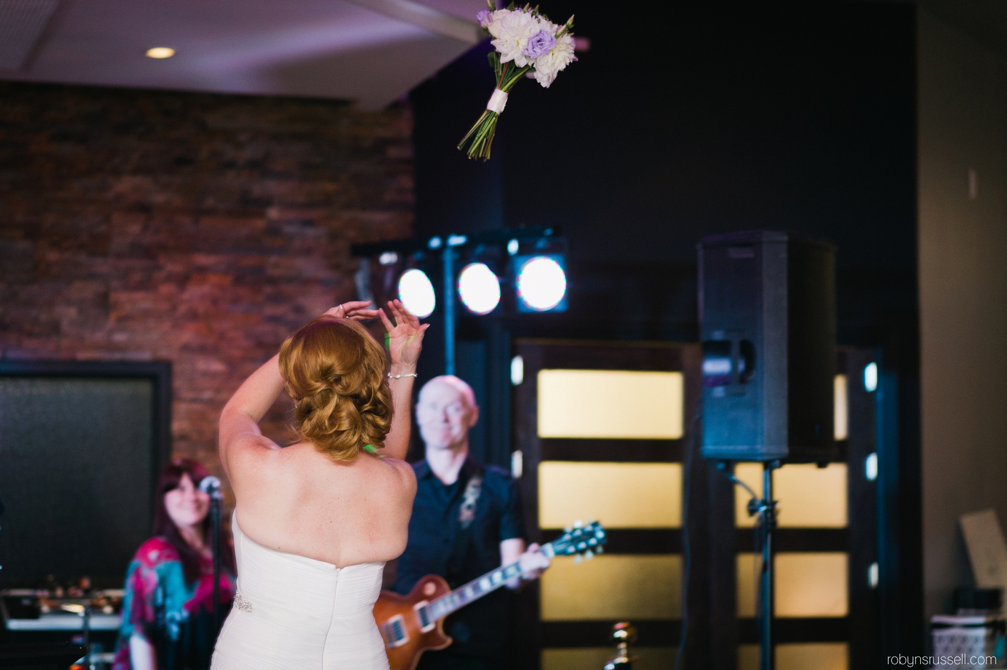 41-bride-tosses-bouquet-harbour-banquet-hall.jpg