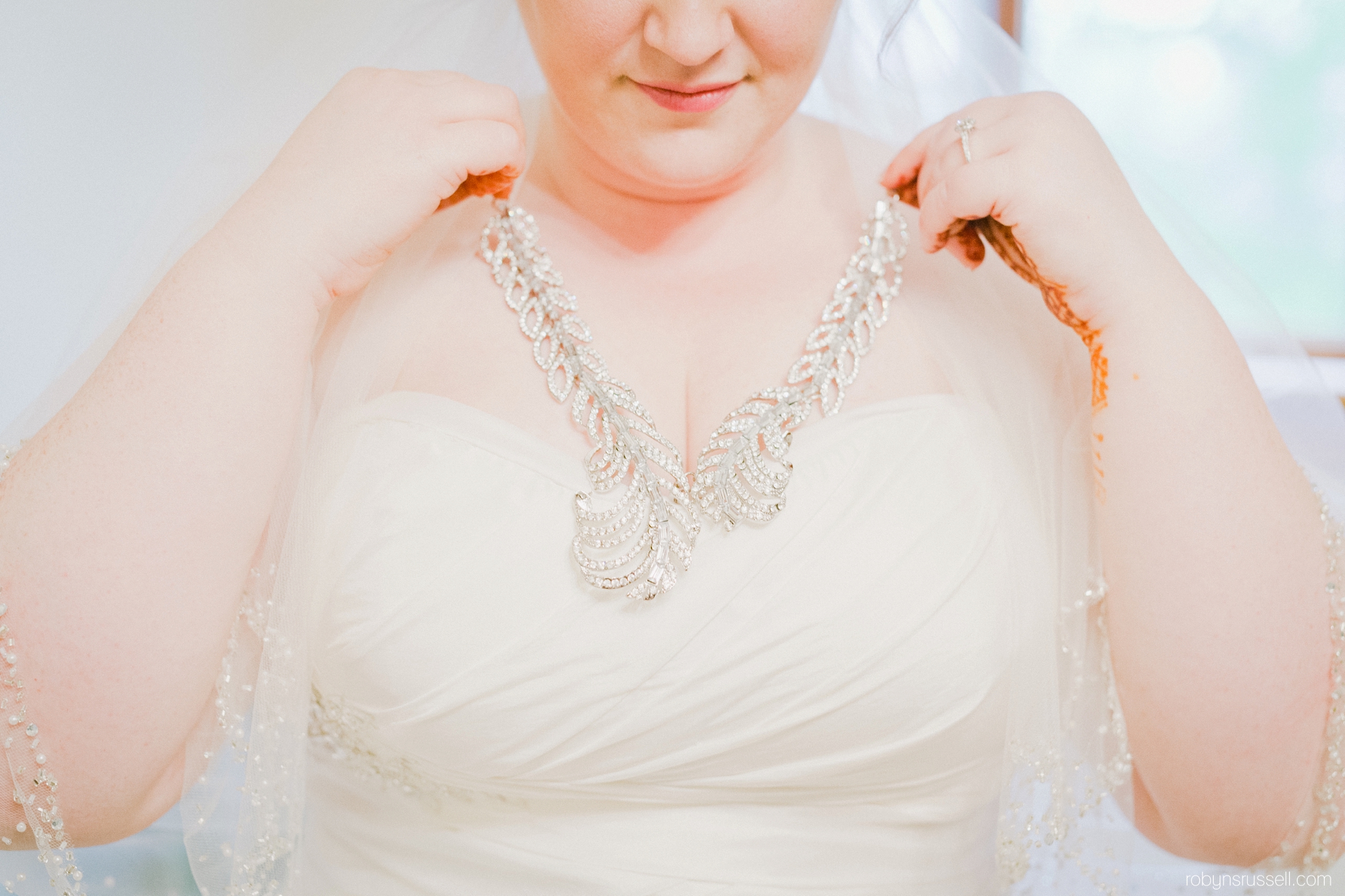 7-bride-wearing-beautiful-necklace-on-wedding-day.jpg