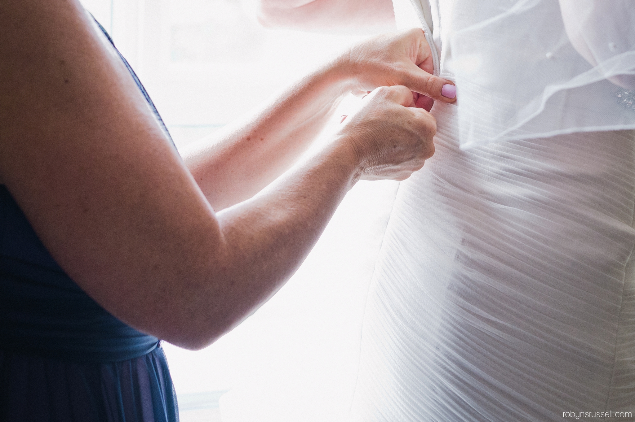 9-putting-on-wedding-dress.jpg