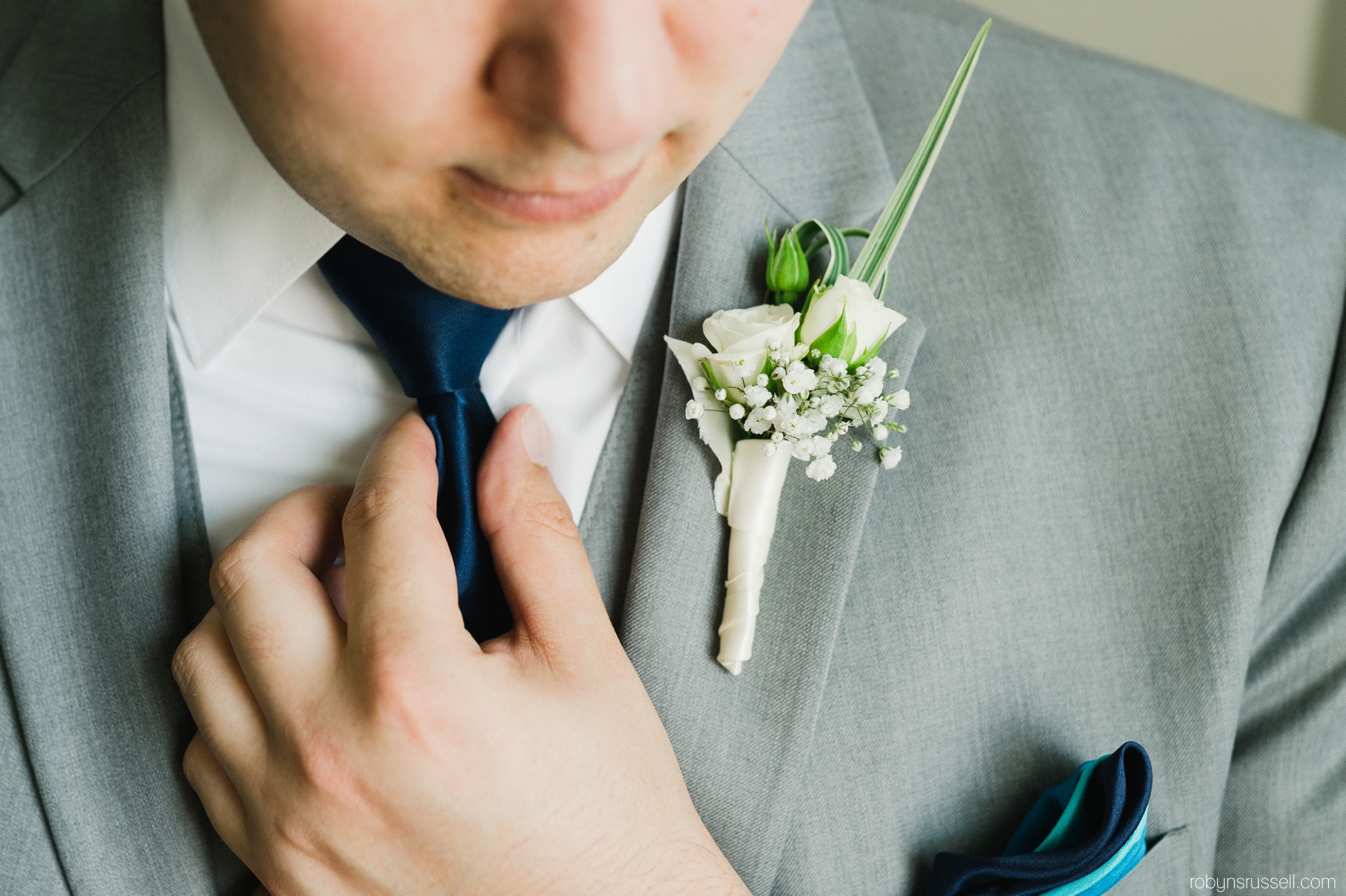 1-groom-fixing-tie.jpg