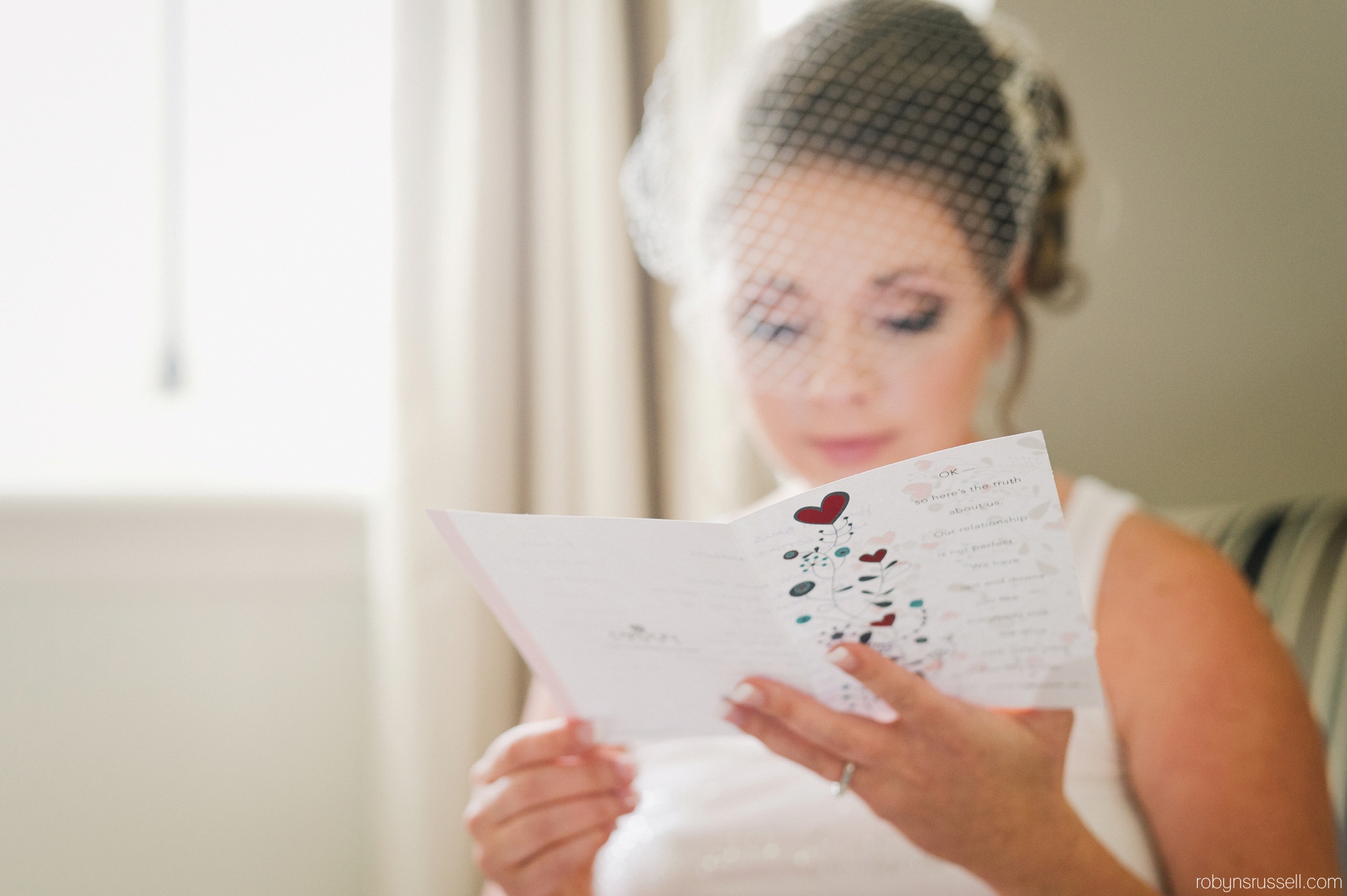 13-bride-reading-card-from-groom-langdon-hall.jpg