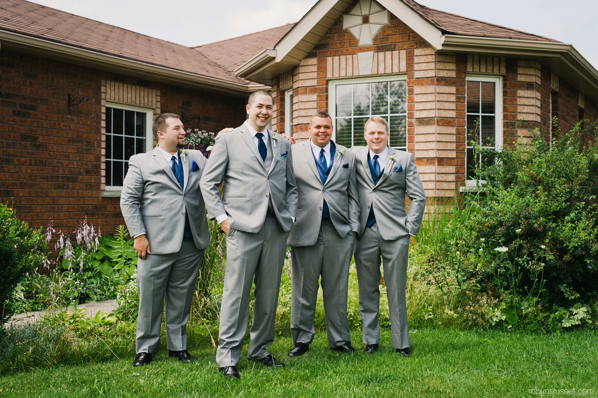 4-groom-and-groomsmen-outside-home-barrie.jpg