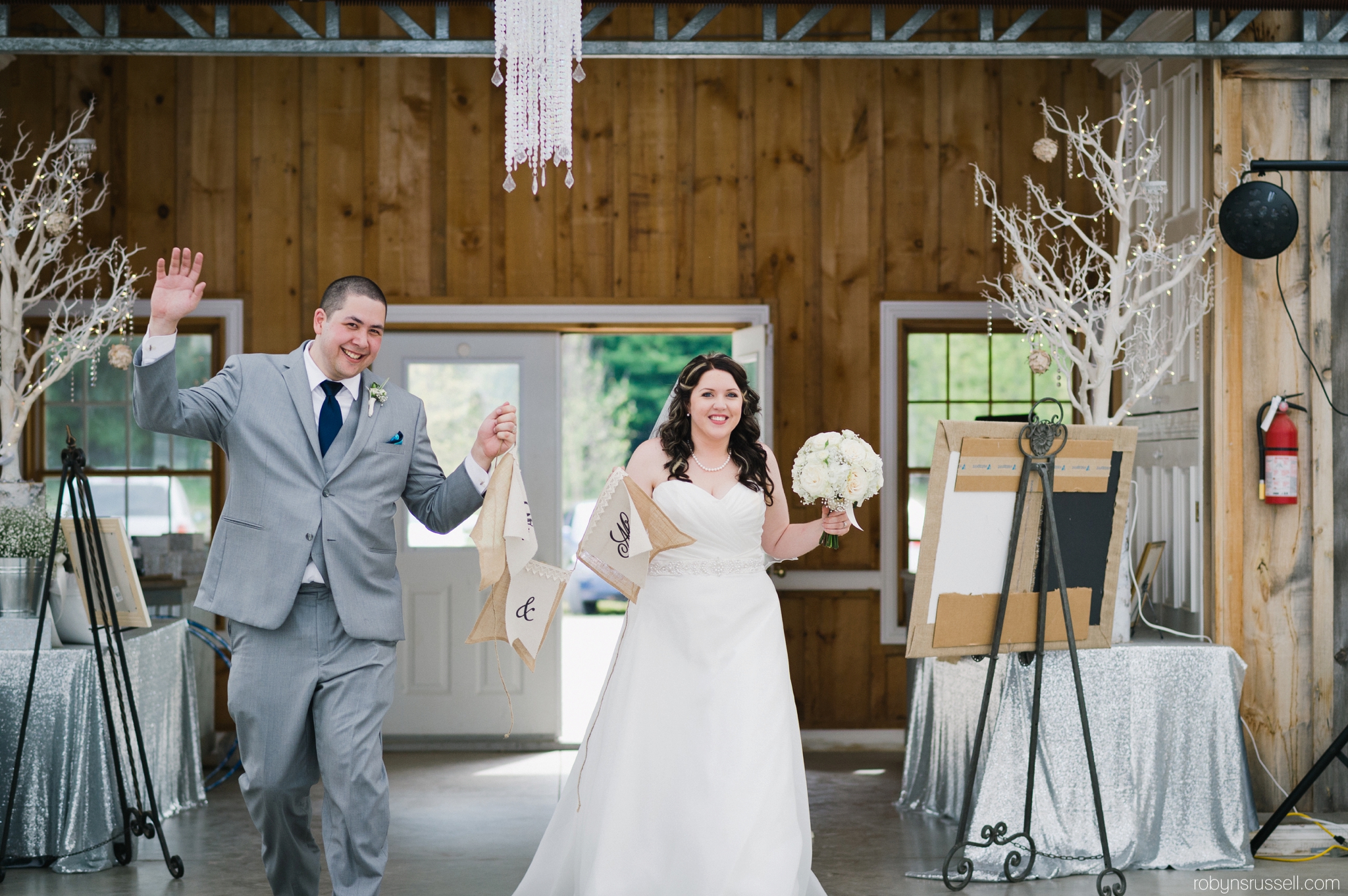 49-bride-and-groom-entrance-drysdale-tree-farm-tent.jpg