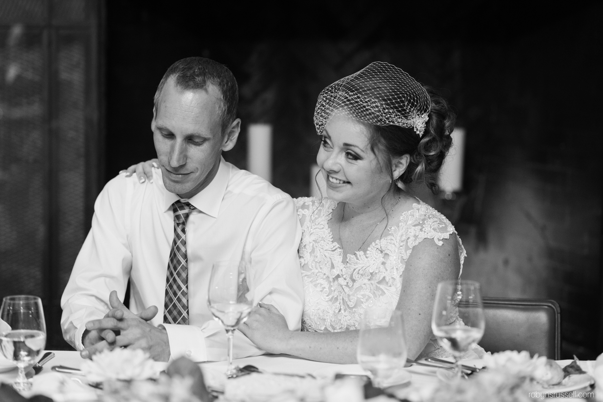 56-bride-and-groom-enjoying-speeches.jpg