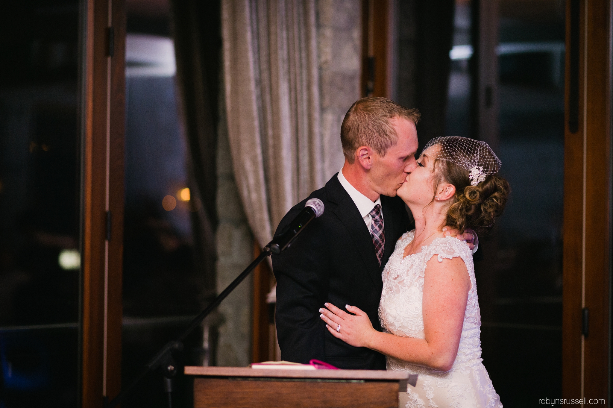 61-bride-and-groom-kiss-cambridge-mill.jpg