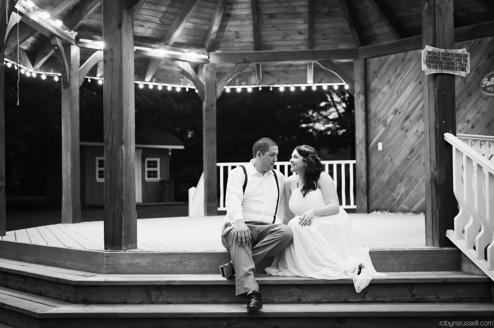 66-bride-and-groom-under-gazebo-at-night.jpg