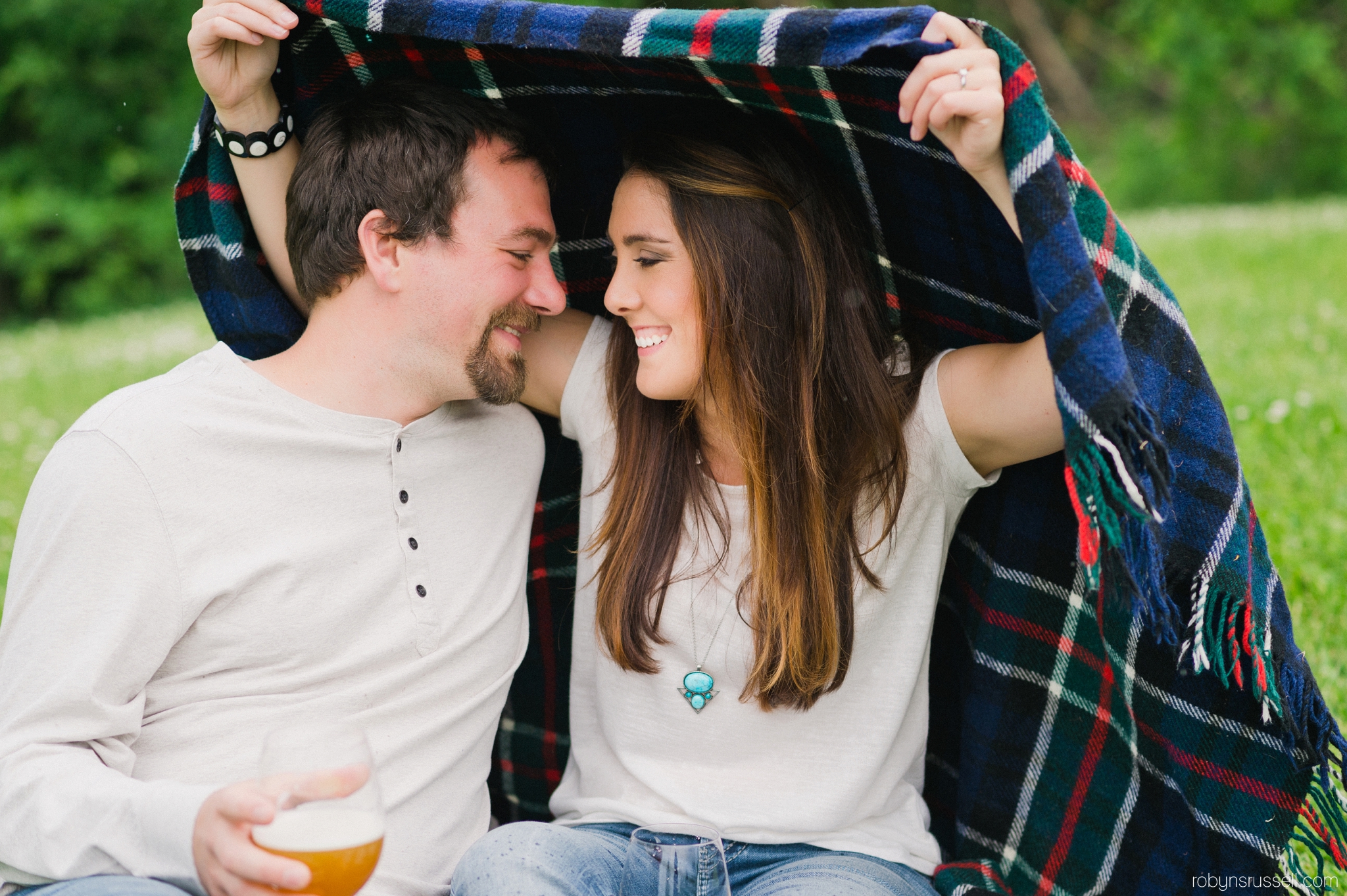 4-engagement-session-bride-and-groom-under-blanket-in-the-rain.jpg